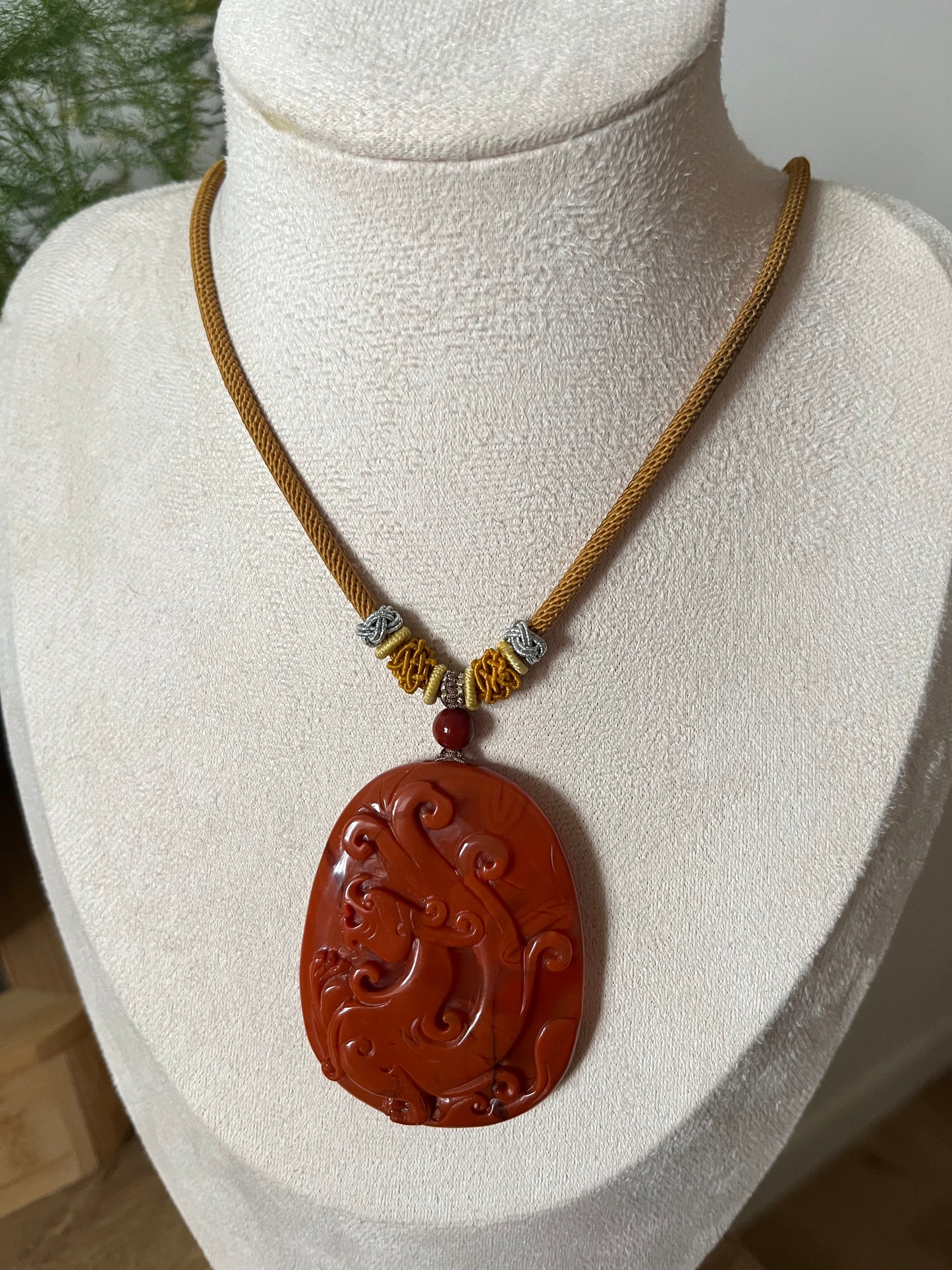 Hand Carved Nanhong Agate Chi Dragon Pendant