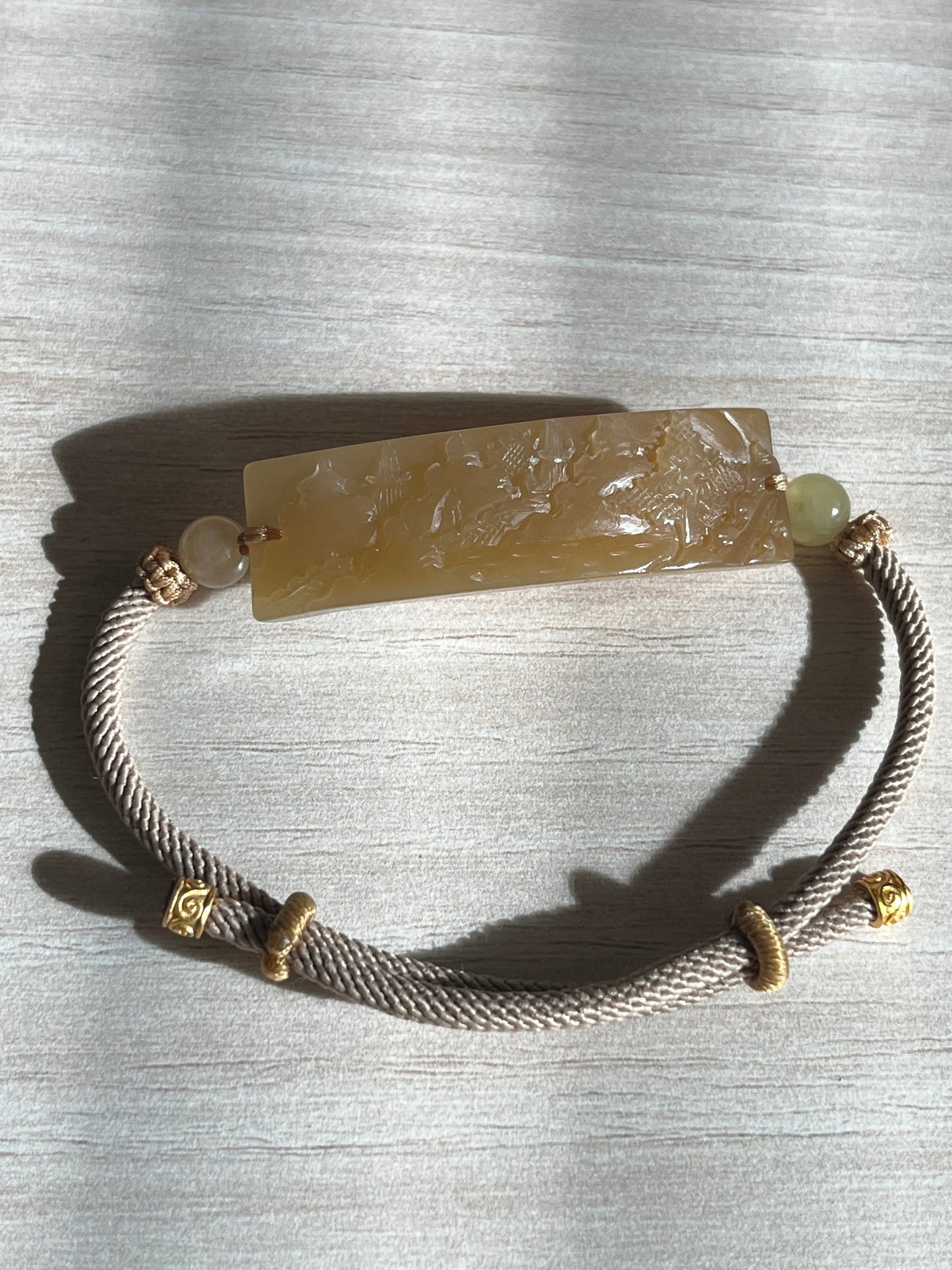 Bracelet Crafted from a Hand Carved Brown Hetian Jade Landscape Pendant | 手雕和田浅糖山水手牌