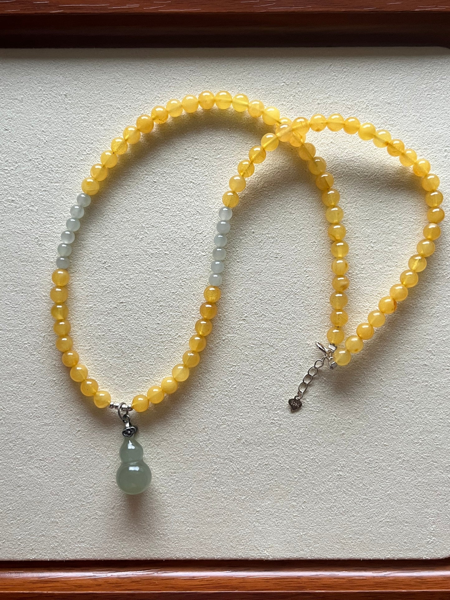 Necklace Crafted from 5mm Amber Beads and 4mm Hetian Jade Beads with a Hetian Jade Hulu Pendant