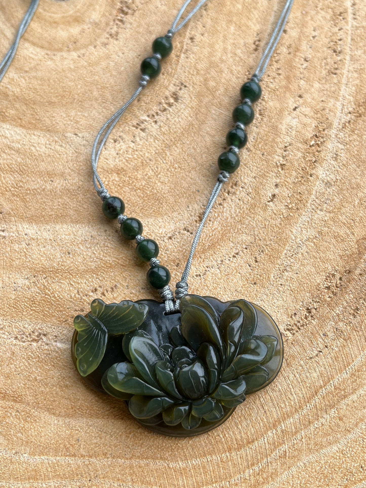 Hand Carved Tea Green Xiu Jade Peony and Butterfly Ruyi Pendant