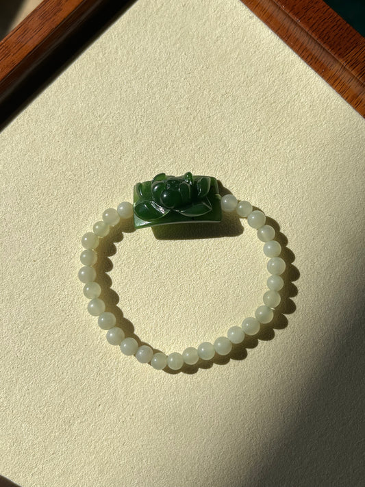 Bracelet Crafted from a Hand Carved Green Hetian Jade Lotus Pendant | 手雕碧玉小荷花手牌