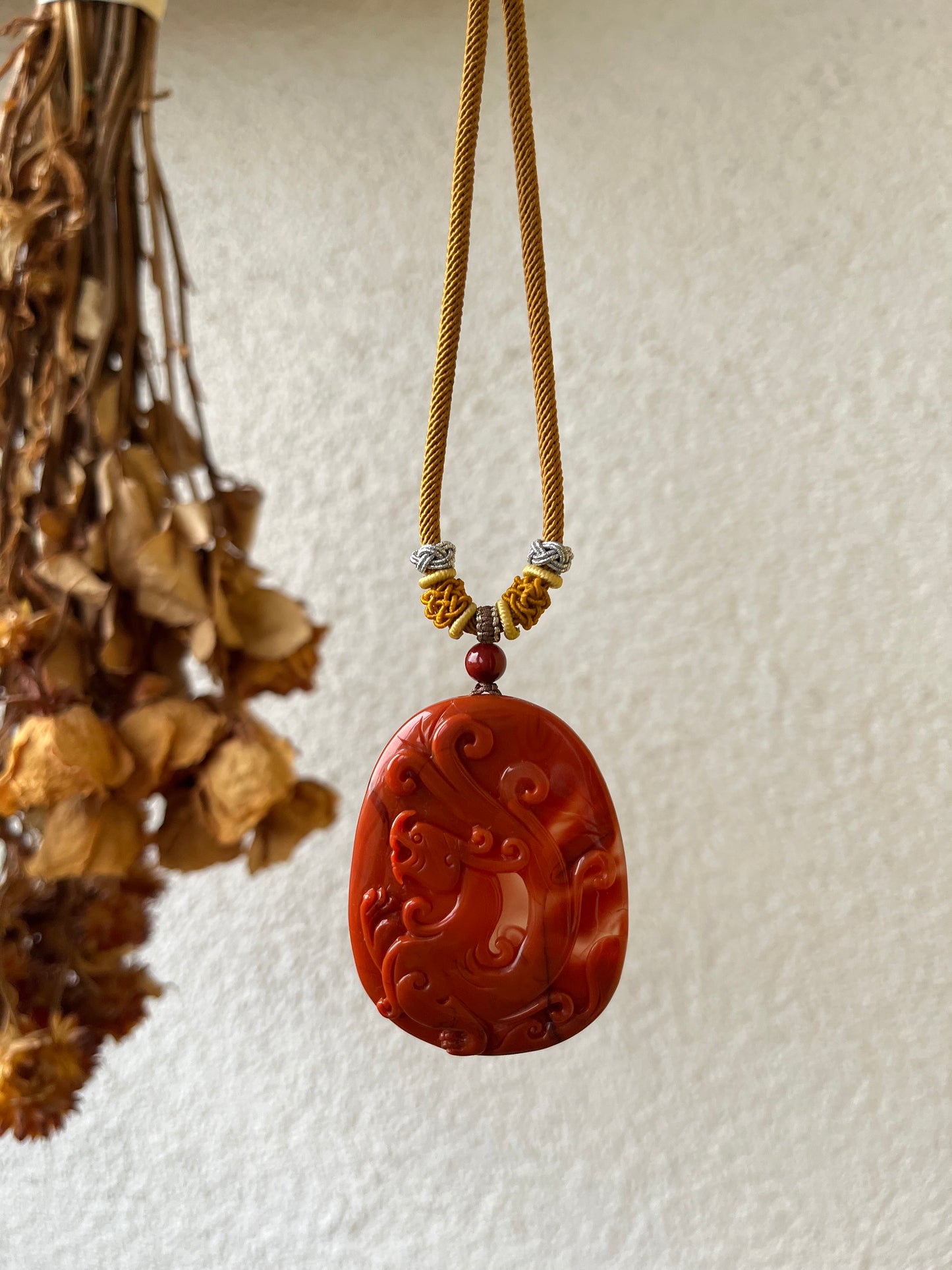 Hand Carved Nanhong Agate Chi Dragon Pendant