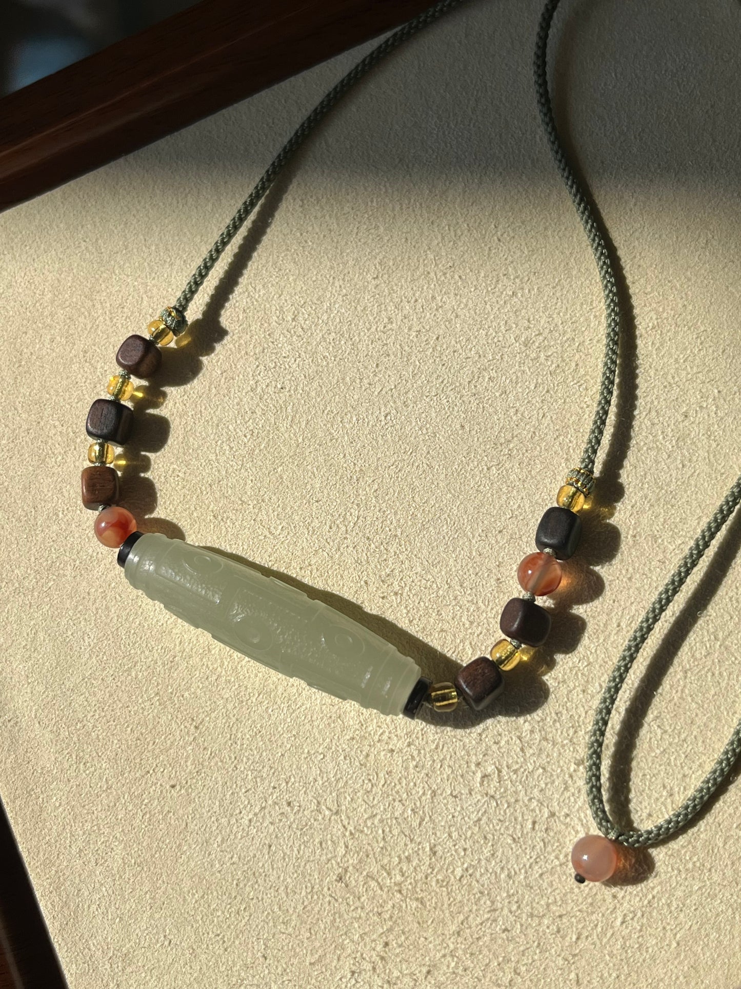 Necklace Crafted from a Hetian Jade Nine-Eyed Dzi Bead | 和田晴水九眼天珠