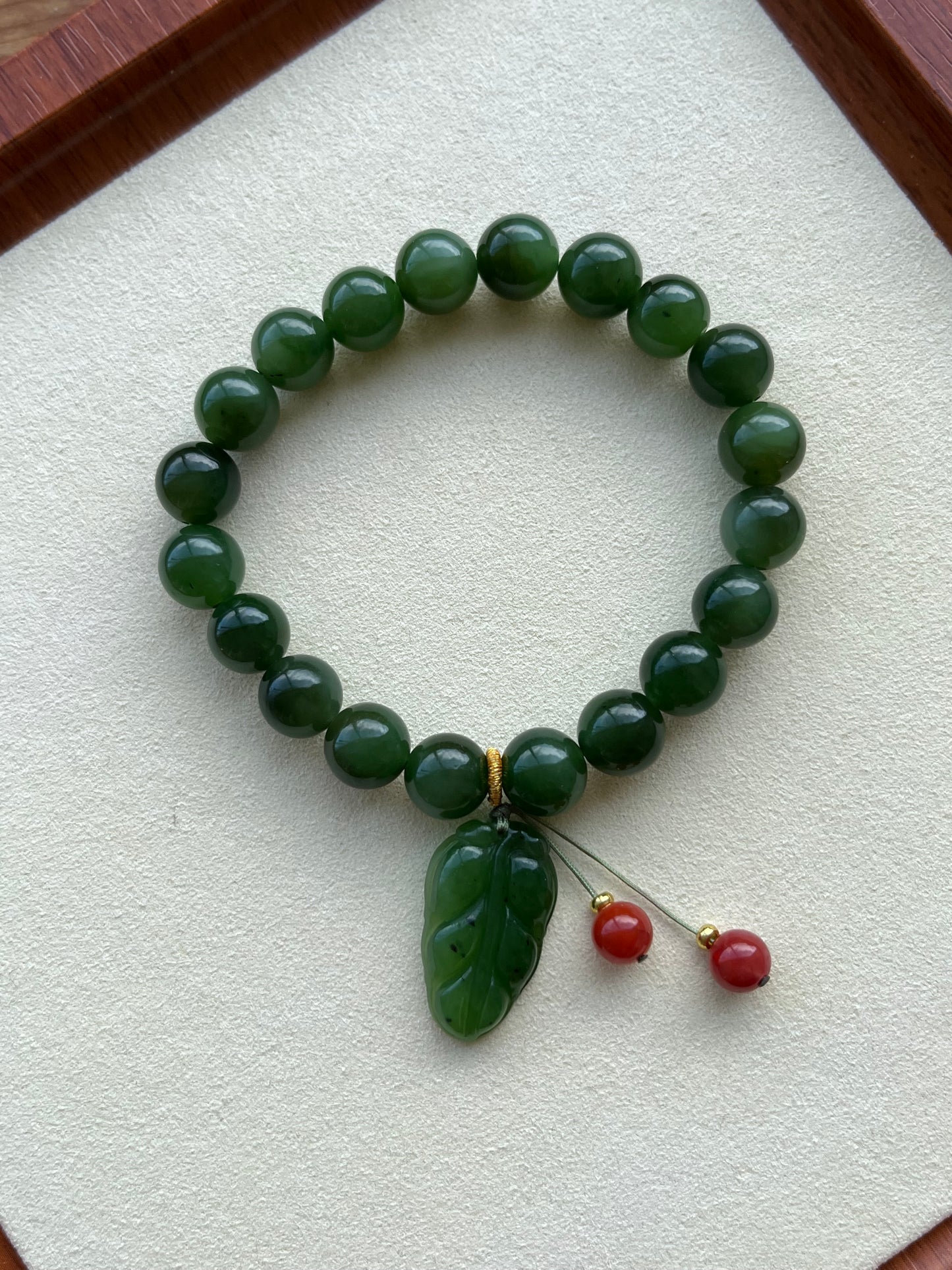 10mm Green Hetian Jade Beaded Bracelet with a Green Leaf Pendant
