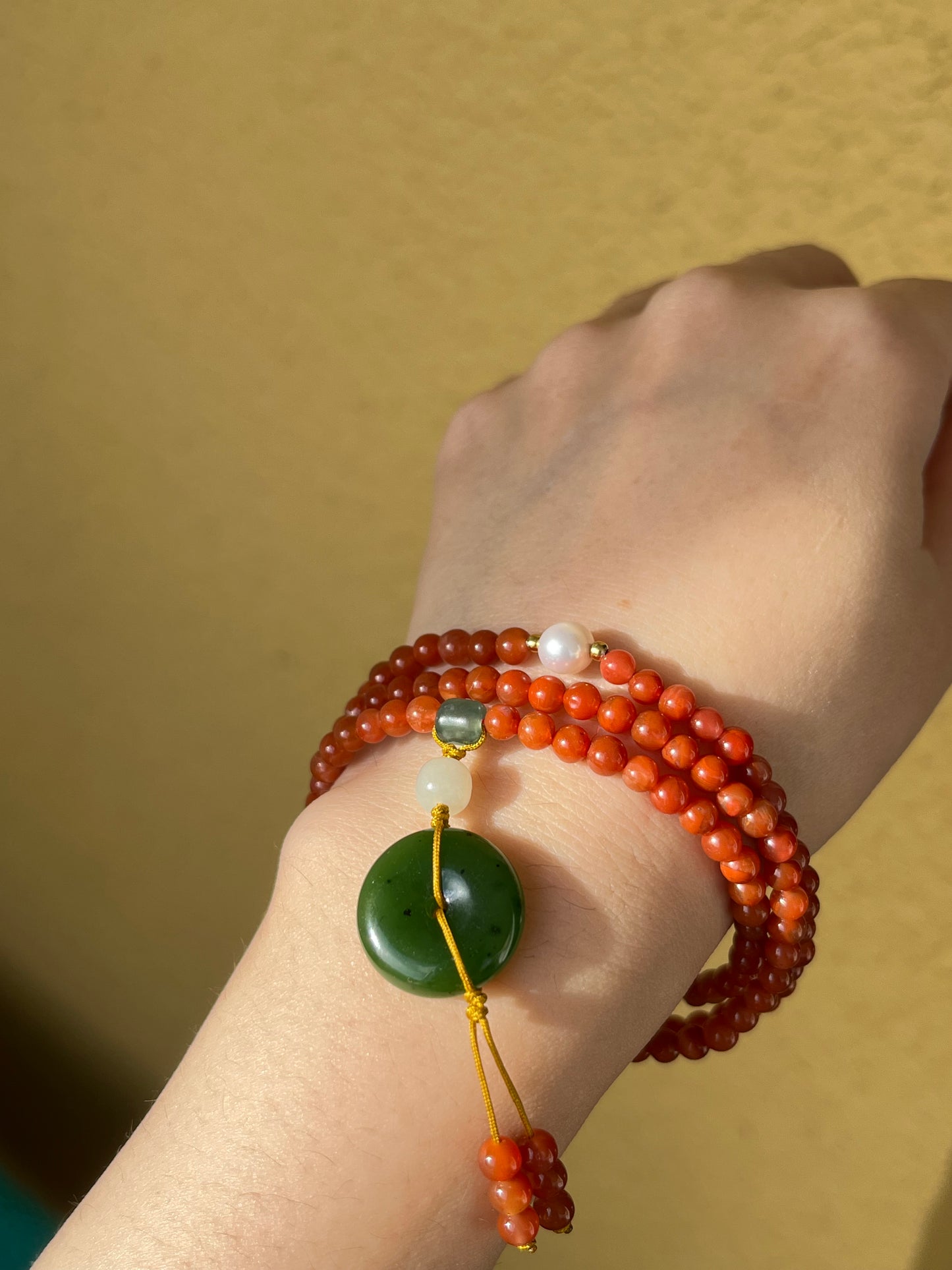 Multi-Function Three Loop Southern Red Agate Beaded Bracelet with a Green Hetian Jade PI pendant (ping an kou), 南红多圈手串加碧玉平安扣