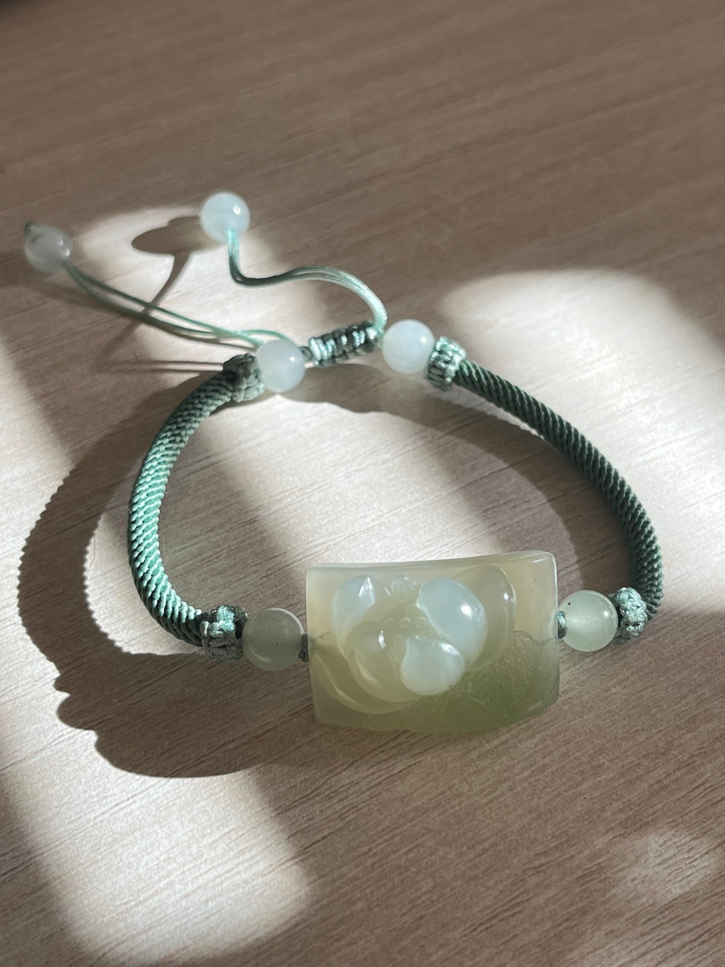 Bracelet Crafted from a Hand Carved Hetian Jade Lotus  | 和田微带翠荷花牌
