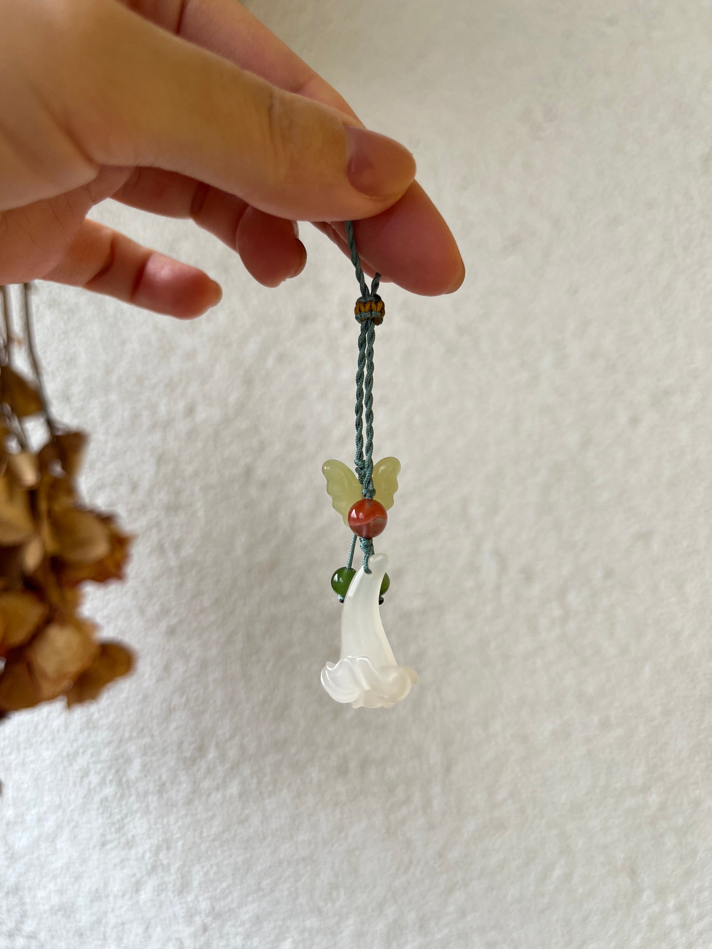 Handmade Phone Charm with a Hand Carved Hetian Jade Trumpet Flower and Butterfly