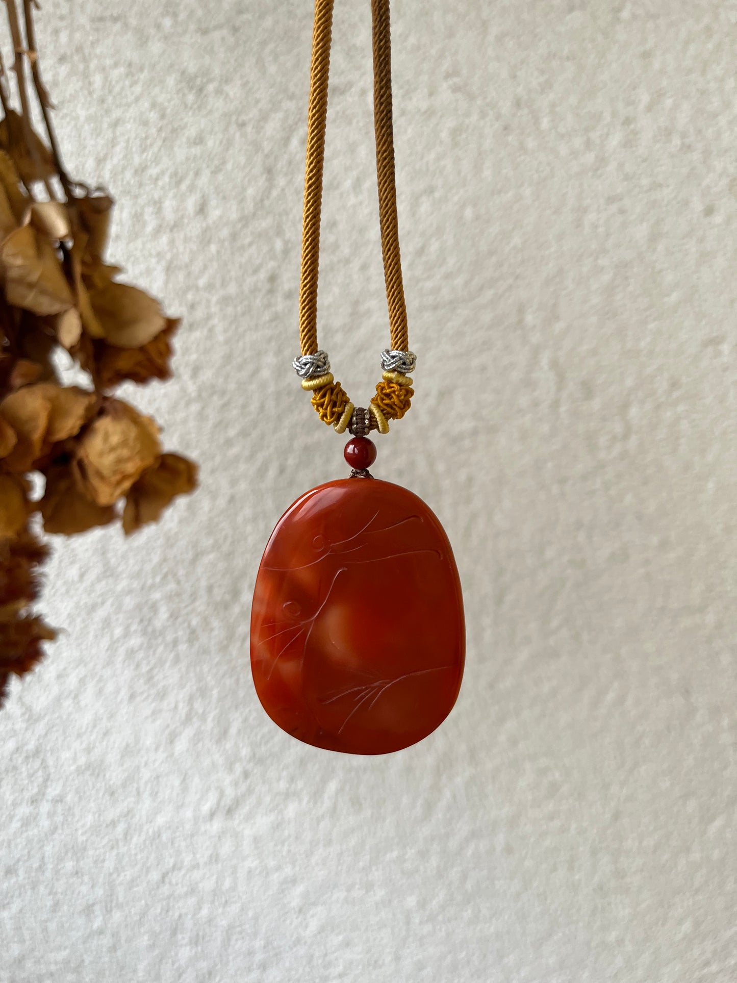 Hand Carved Nanhong Agate Chi Dragon Pendant