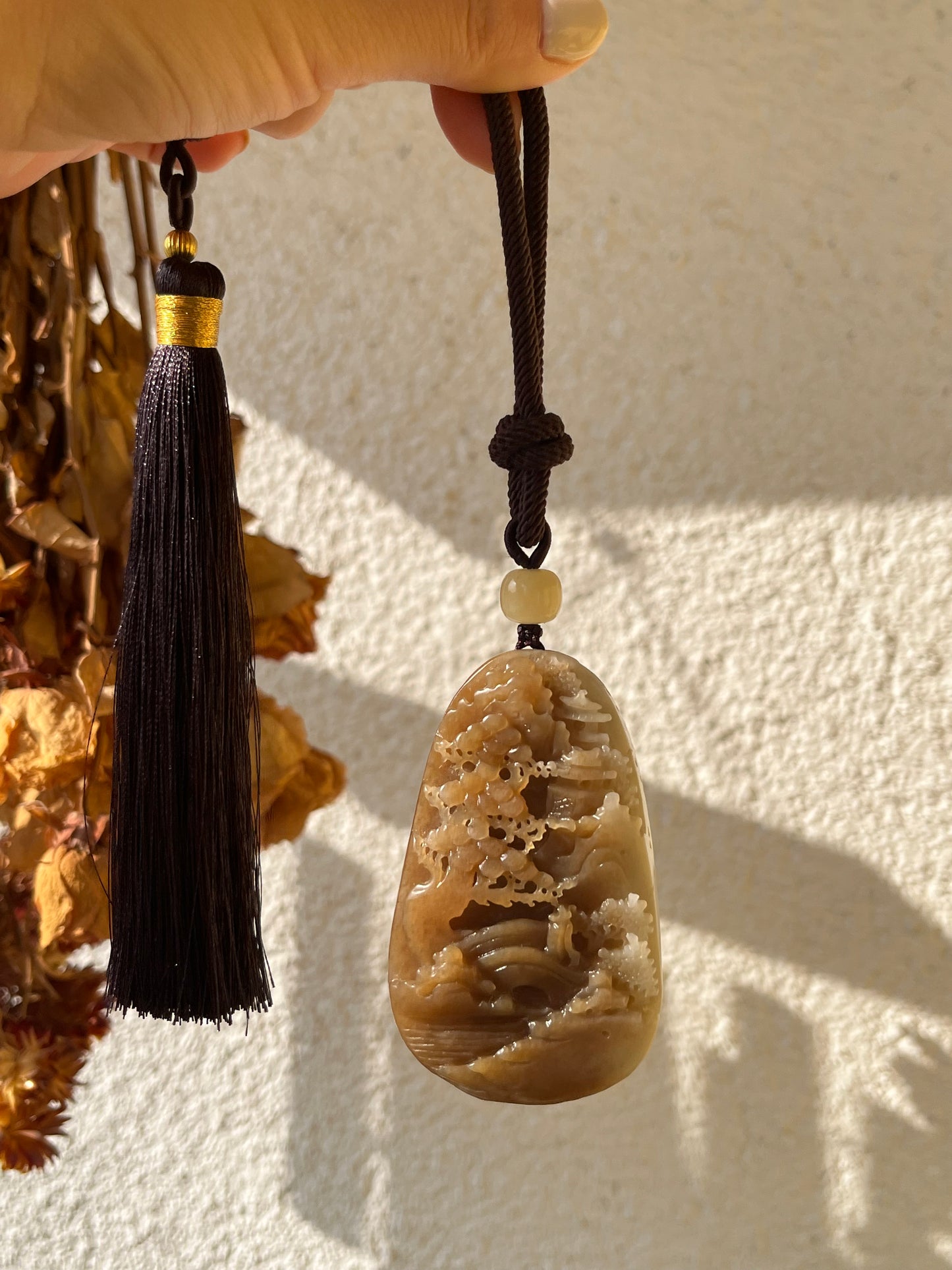 Hand Carved Brown and White Hetian Jade Landscape Pendant | 手雕糖白和田玉山水手把件