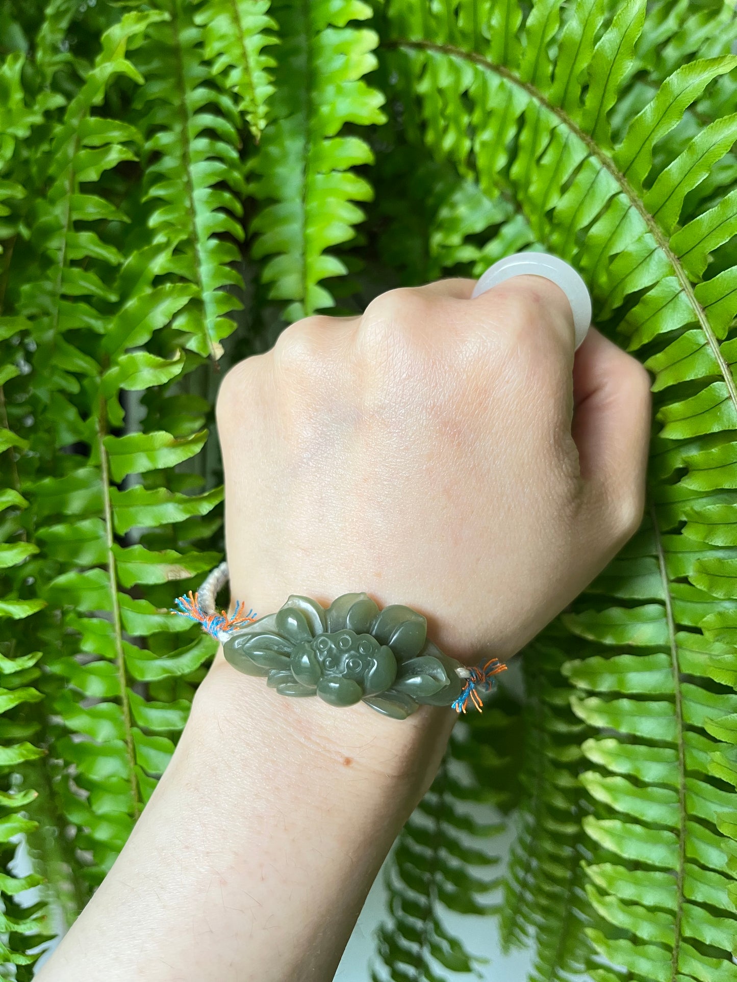 Handmade Bracelet with a Hand Carved Green Hetian Jade Lotus Pendant