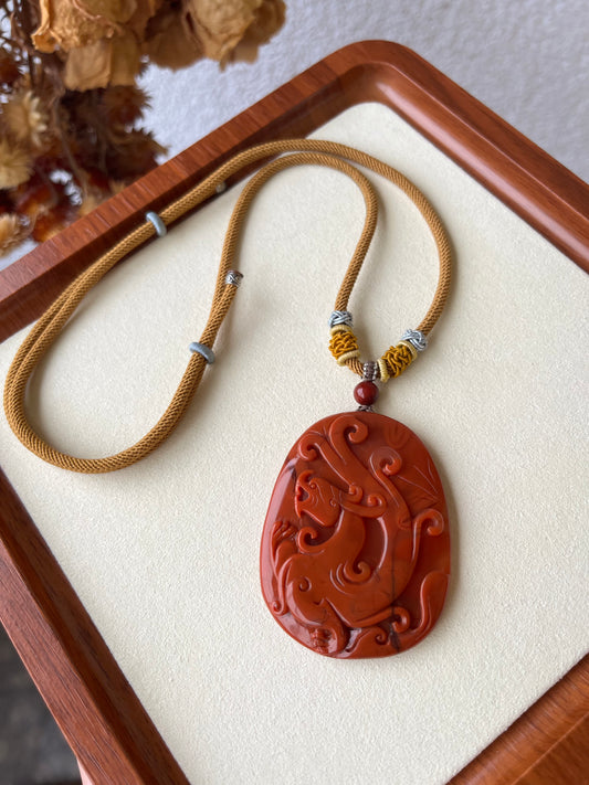 Hand Carved Nanhong Agate Chi Dragon Pendant