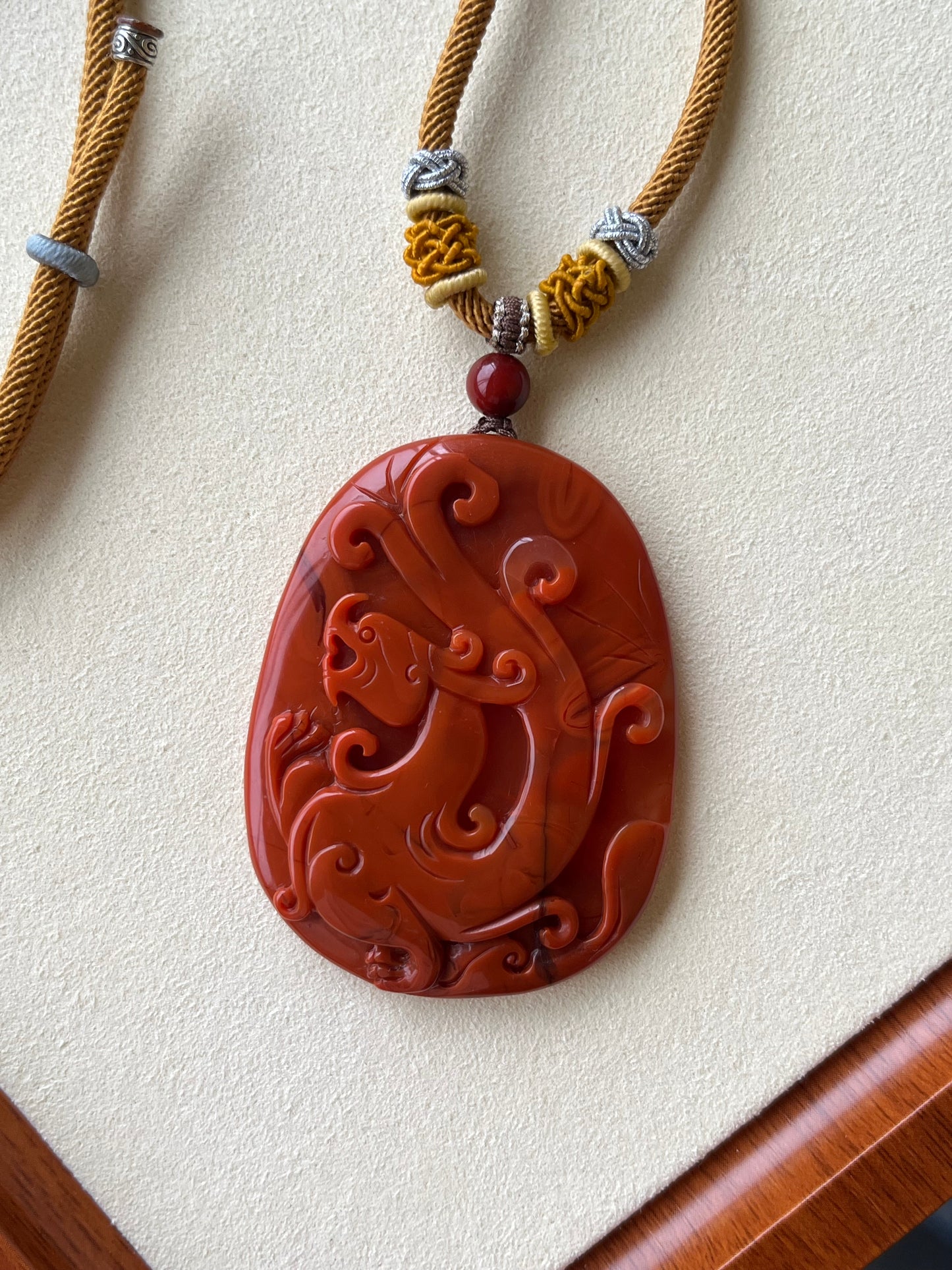 Hand Carved Nanhong Agate Chi Dragon Pendant