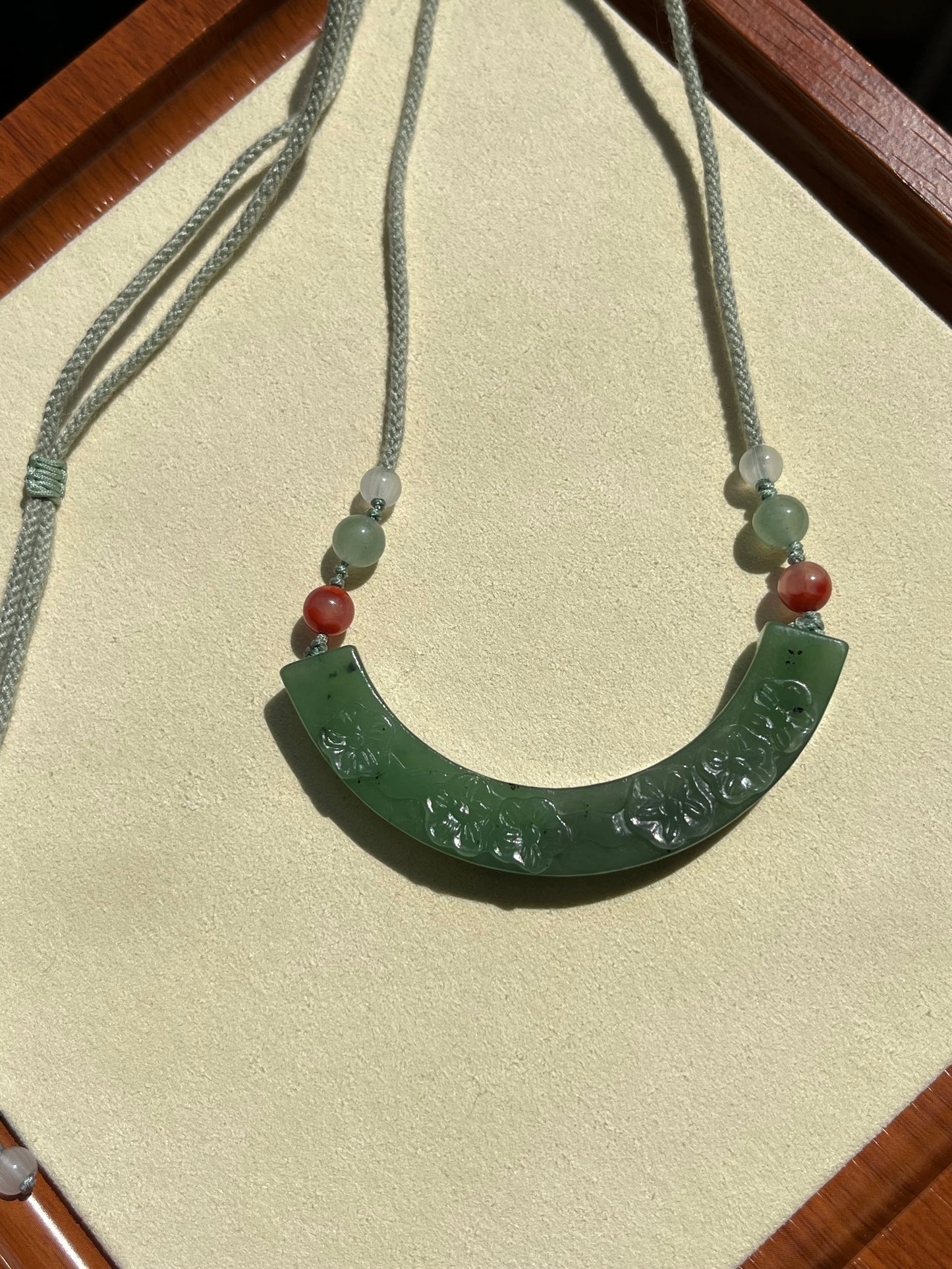 Hand Carved Green Hetian Jade Plum Blossom Arc-shaped Huang Pendant | 手雕碧玉梅花玉璜