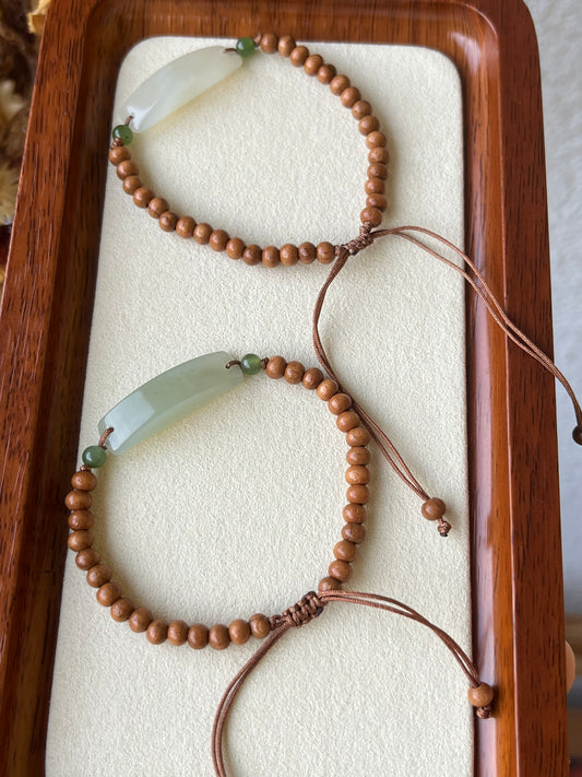 Handmade Bracelet with a small Hetian Jade Pendant and Olive Nut Beads