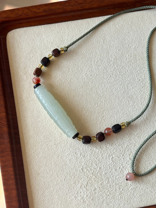 Necklace Crafted from a Hetian Jade Nine-Eyed Dzi Bead | 和田晴水九眼天珠
