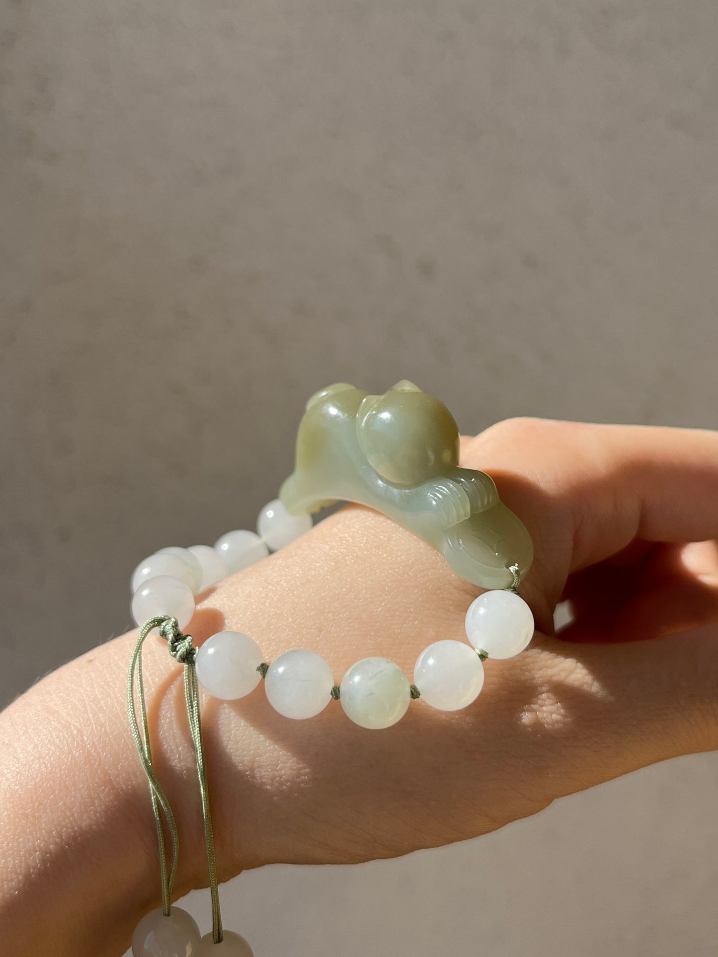 Handwoven Bracelet with a Hand Carved Nephrite Jade Lucky Cat Pendant, 手编和田可爱趴趴招财猫手牌