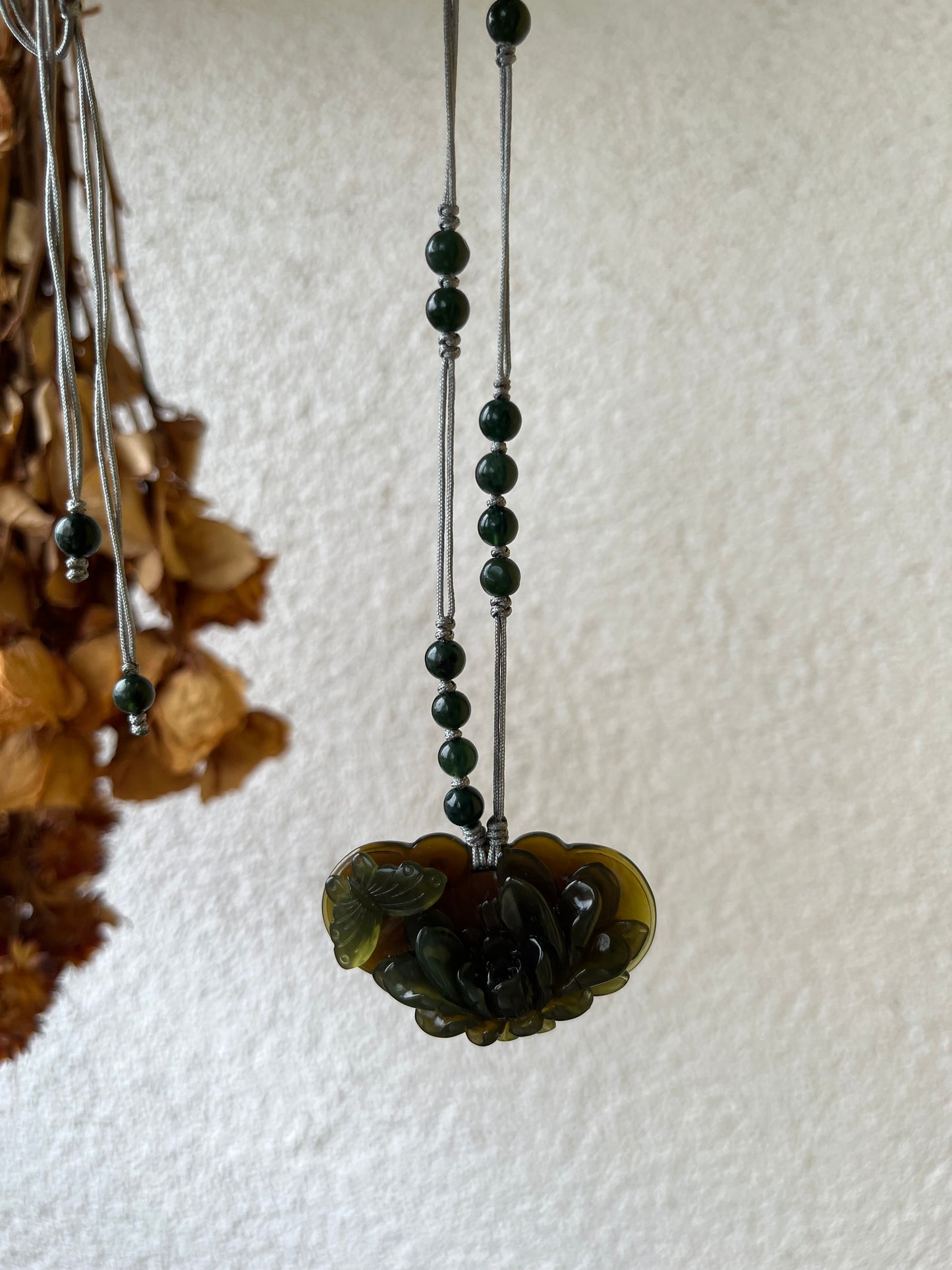 Hand Carved Tea Green Xiu Jade Peony and Butterfly Ruyi Pendant