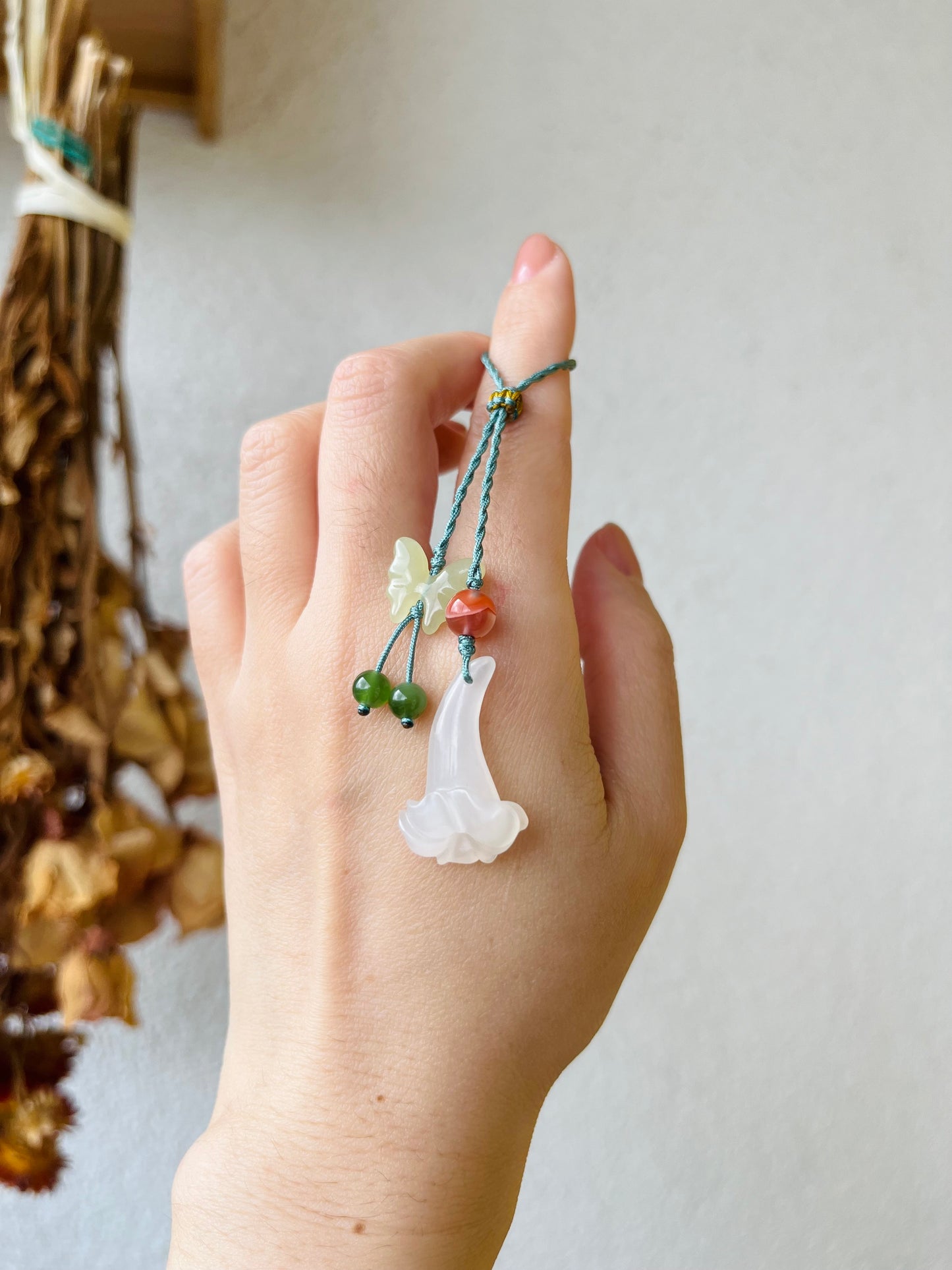Handmade Phone Charm with a Hand Carved Hetian Jade Trumpet Flower and Butterfly