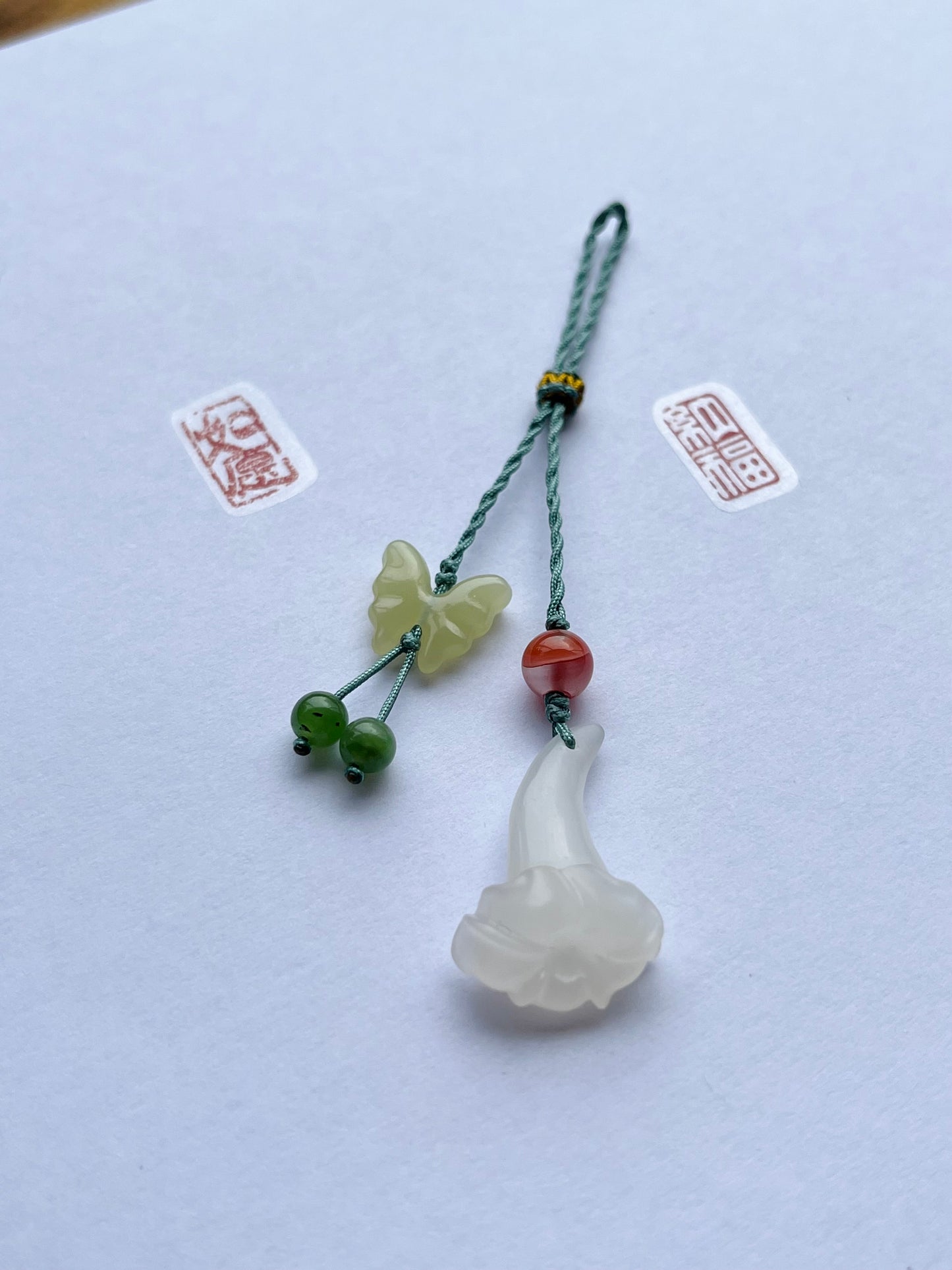 Handmade Phone Charm with a Hand Carved Hetian Jade Trumpet Flower and Butterfly