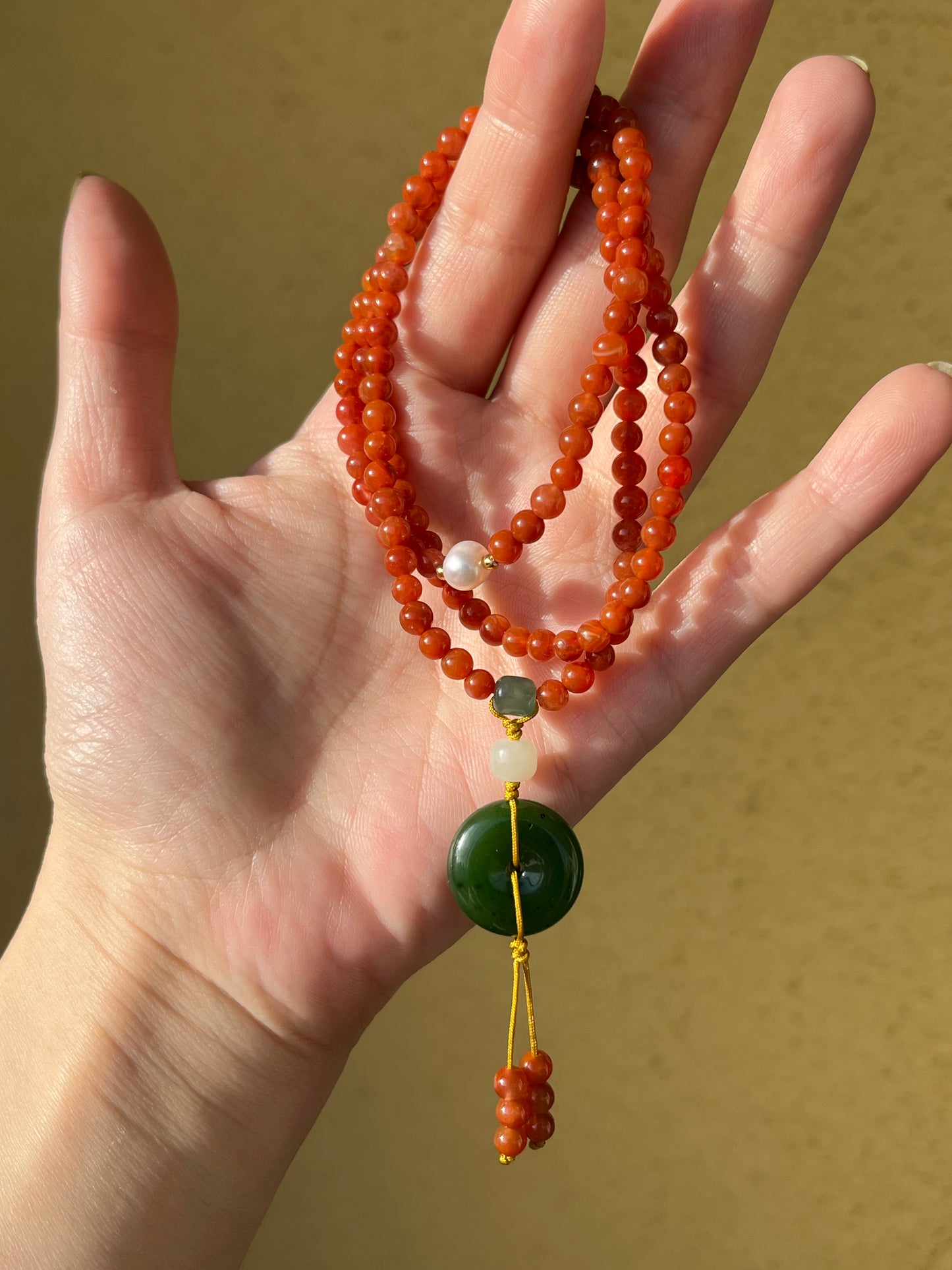 Multi-Function Three Loop Southern Red Agate Beaded Bracelet with a Green Hetian Jade PI pendant (ping an kou), 南红多圈手串加碧玉平安扣