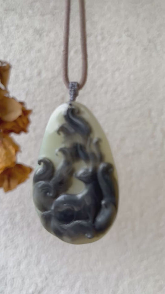 Hand Carved Black and White Hetian Jade Nine-tailed Fox Pendant |  精雕和田青花九尾狐